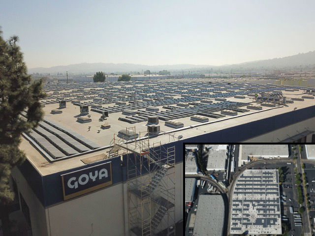 Aerial view of the Goya Foods warehouse roof covered in solar panels, with a satellite inset of the building