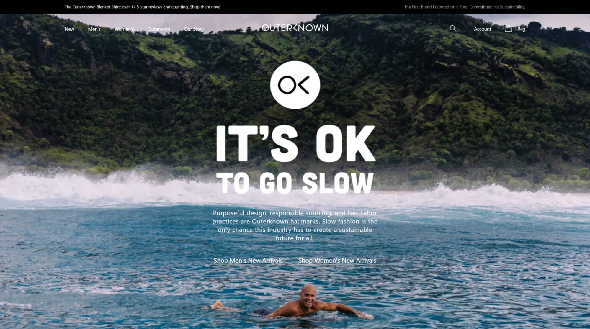 Outerknown homepage: 'It's OK to go slow' over a surfer paddling in the sea, describing slow fashion and responsible sourcing