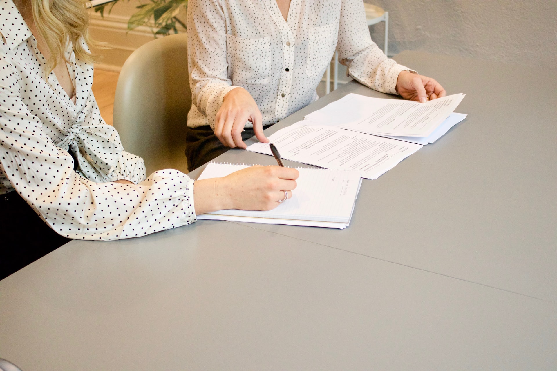 Two executives signing a contract