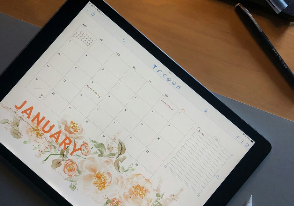 January shown on a blank calendar with a blank list of goals beside it